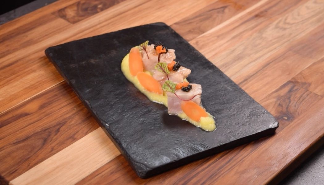 Sea bass sellado en salsa de champagne